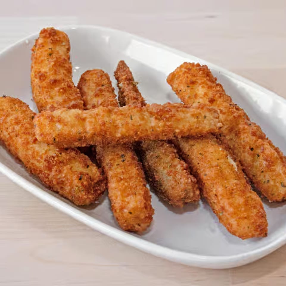 A white rectangular plate filled with golden-brown, breaded mozzarella sticks.